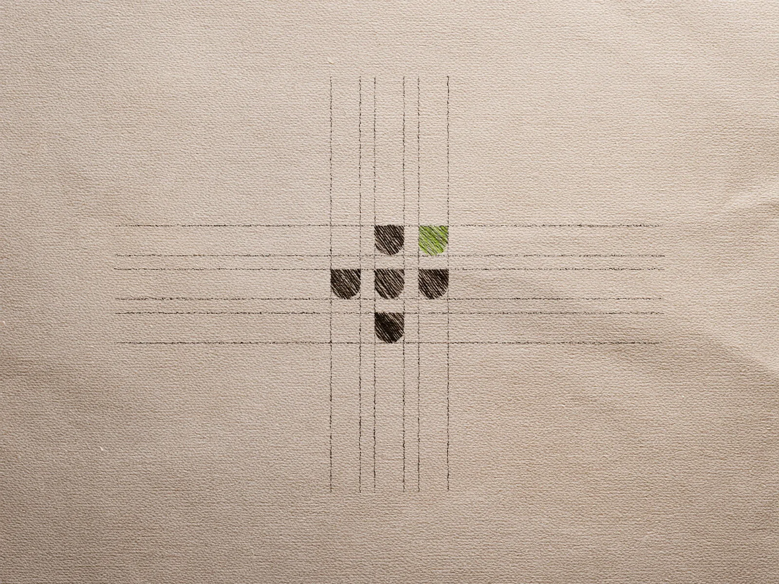 Sketch do símbolo da Valour desenhado sobre grid em papel texturizado